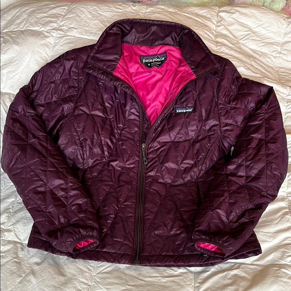 Small Patagonia Purple Puffer Jacket with Stand-Up Collar and Quilted Design
